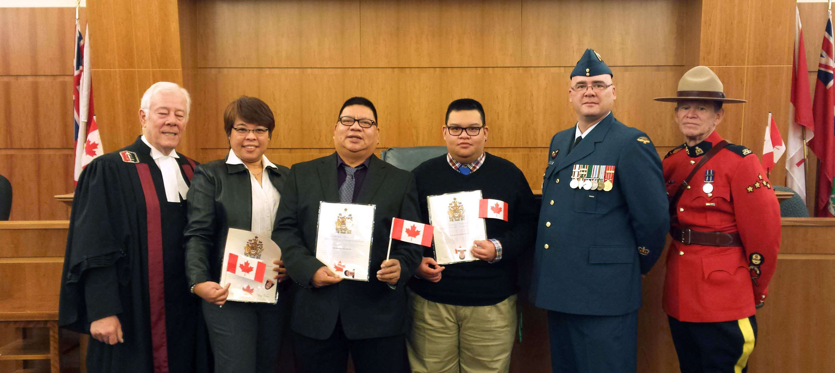 Michael and his family at Canadian citizenship ceremony