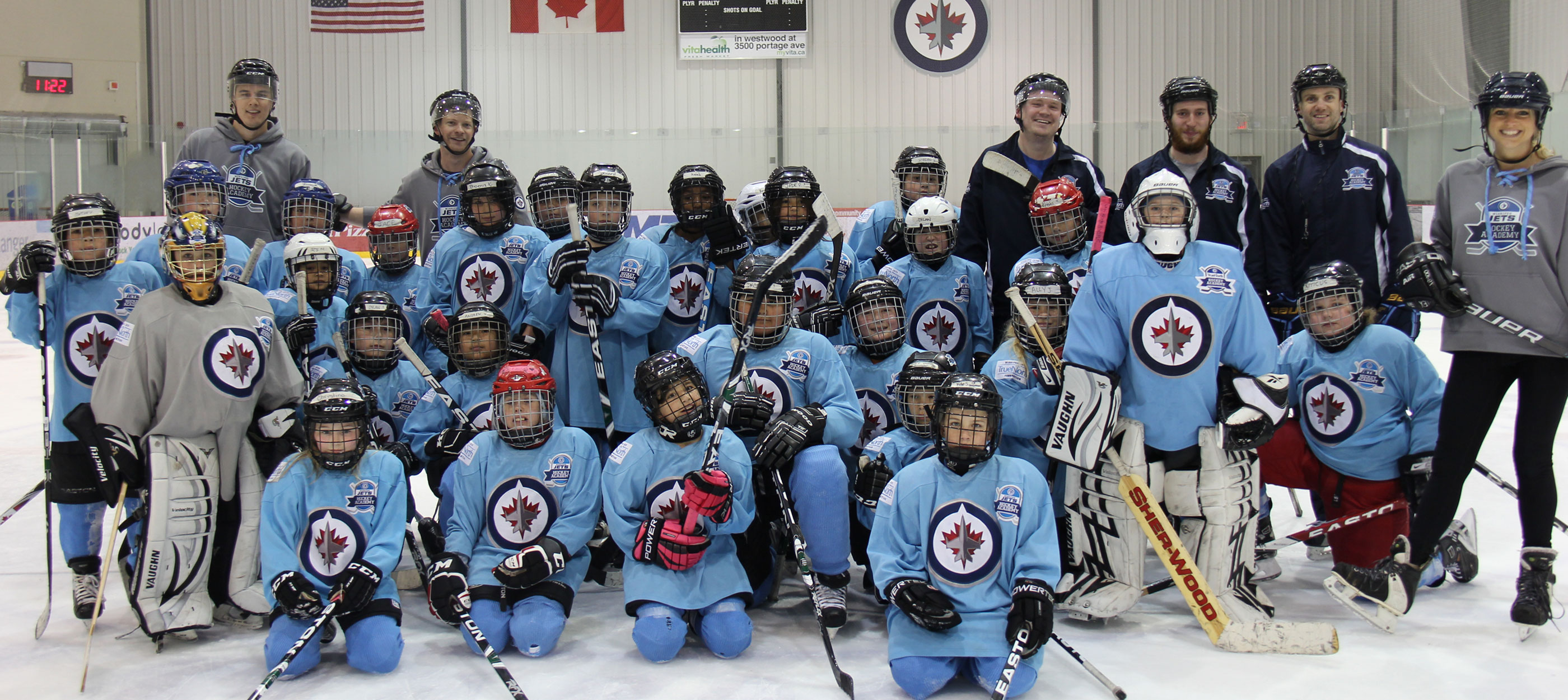 CWB National Leasing employees with Winnipeg Jets Hockey Academy participants