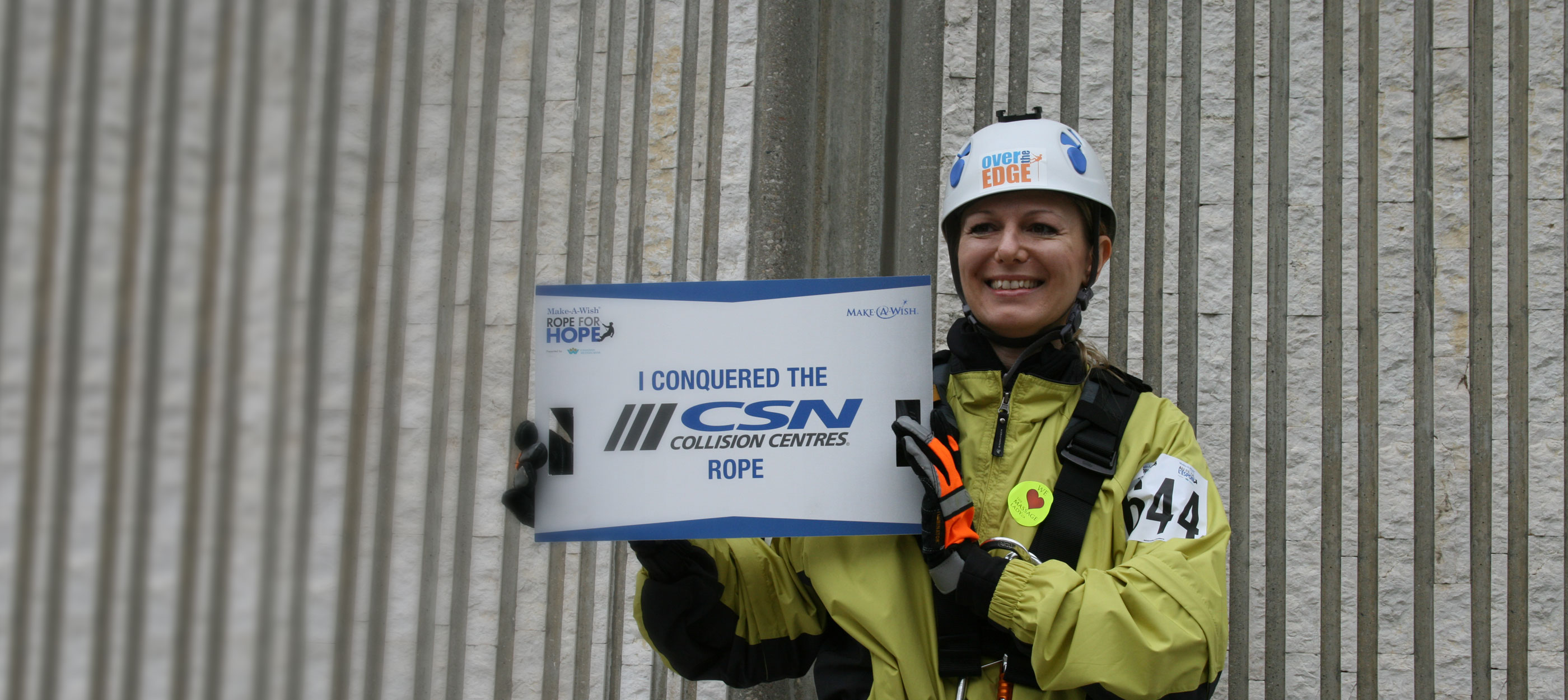 A brave supporter rappelling a skyscraper